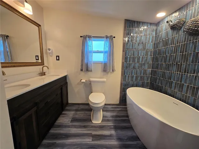 a bathroom with a sink and shower