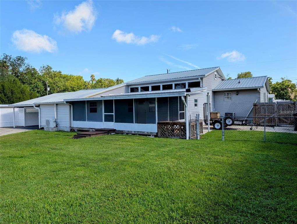 24514 Snail Road Astor, FL 32102 - Photo 2 of 8 a view of a house with a backyard
