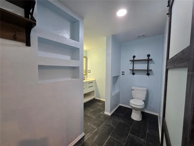a bathroom with a double vanity sink mirror and double