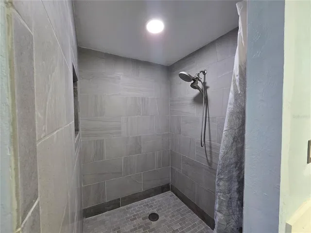 a view of an empty room with windows