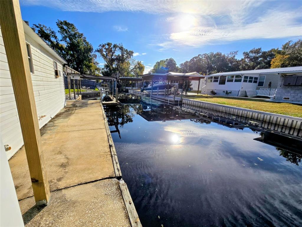 24514 Snail Road Astor, FL 32102 - Photo 5 of 8 a view of a swimming pool with a lounge chair