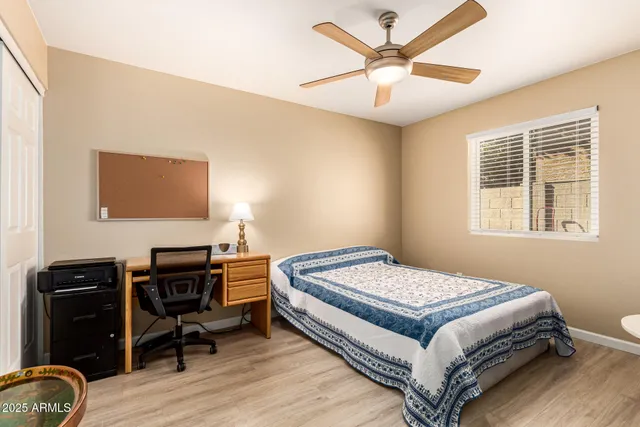 a bathroom with a sink vanity mirror and toilet