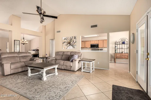 a kitchen with stainless steel appliances a sink cabinets and a refrigerator