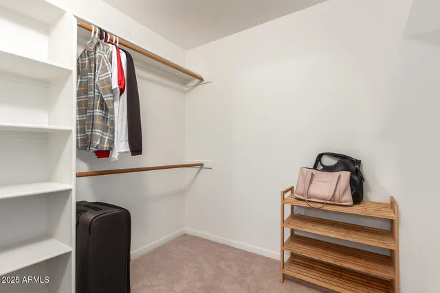 a bedroom with bed and window