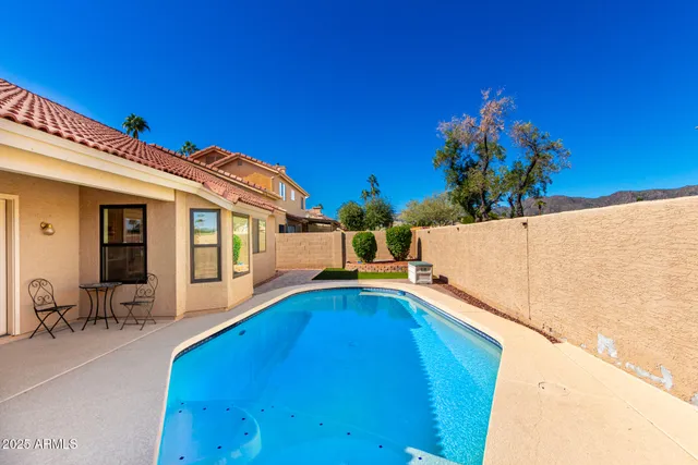 a view of a swimming pool with a patio