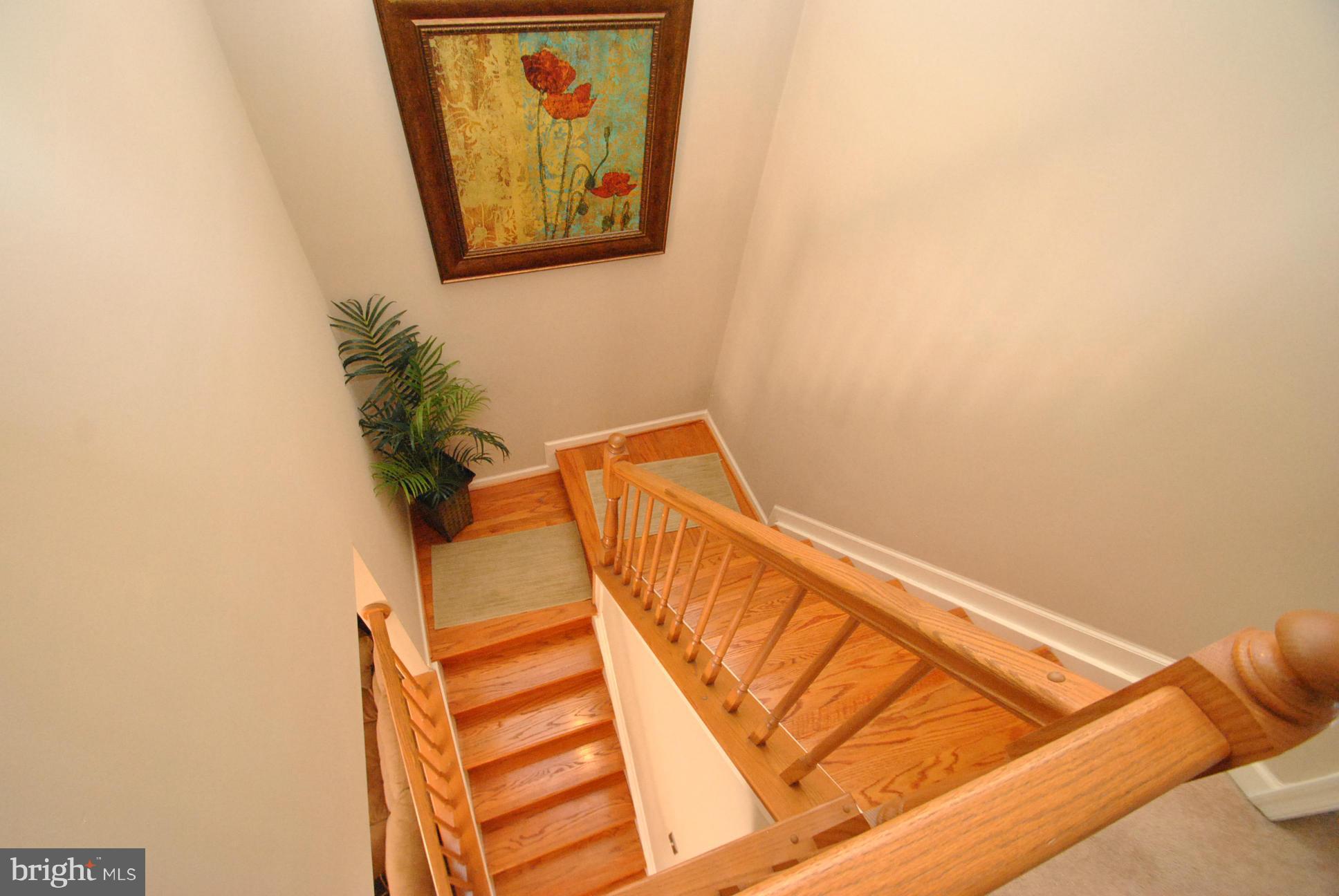 5037 Kemsley Road Baltimore, MD 21237 - Photo 15 of 30 UPPER LEVEL STAIRCASE - HARDWOOD STAIRS