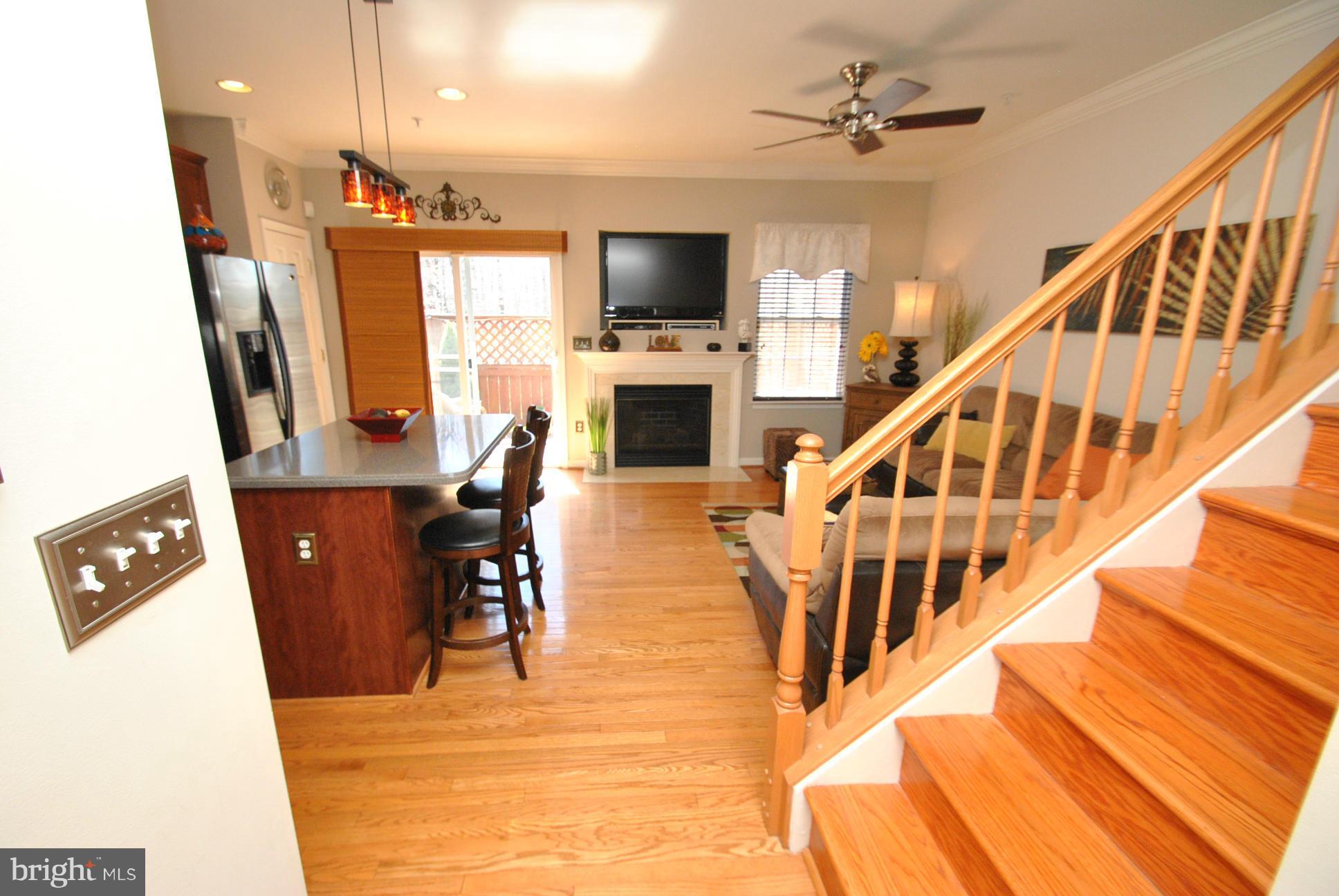 5037 Kemsley Road Baltimore, MD 21237 - Photo 8 of 30 VIEW OF STAIRCASE INTO KITCHEN & FAMILY ROOM