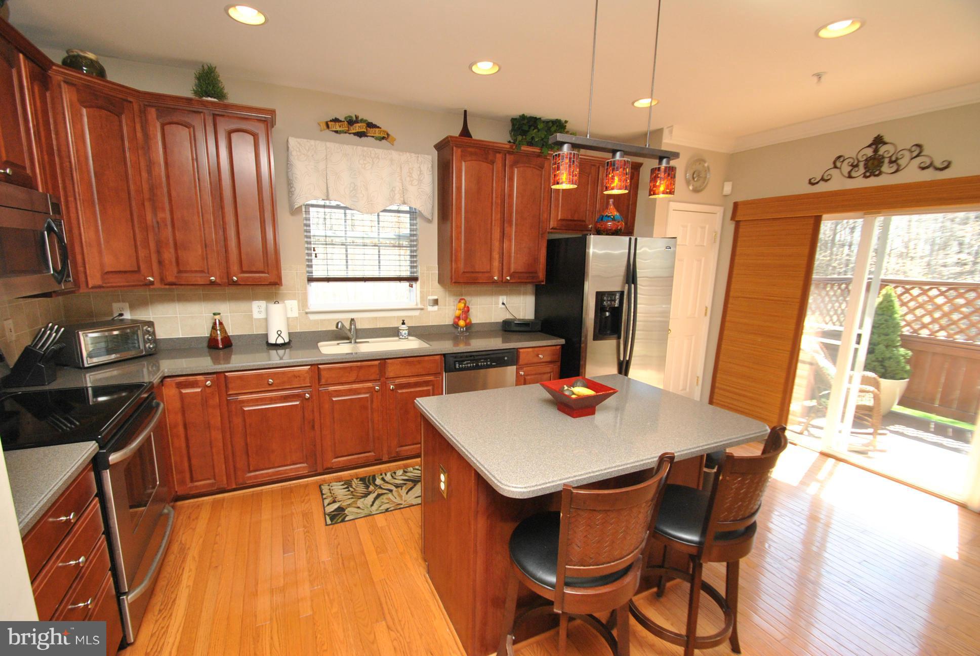 5037 Kemsley Road Baltimore, MD 21237 - Photo 9 of 30 STAINLESS STEEL APPLIANCES, ISLAND, HARDWOOD FLRS
