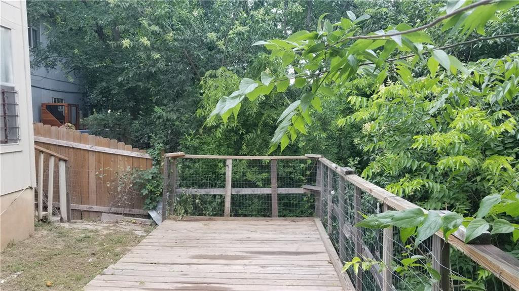 6207 Adalee Avenue, Unit B Austin, TX 78723 - Photo 11 of 11 a view of balcony with wooden floor and fence