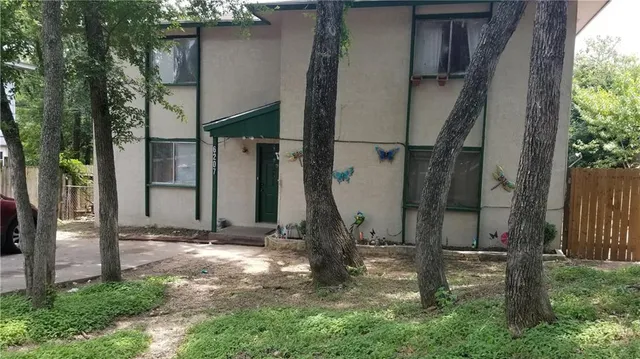 a backyard of a house with lots of green space