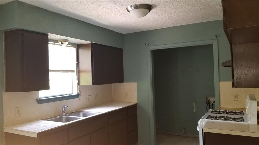 6207 Adalee Avenue, Unit B Austin, TX 78723 - Photo 5 of 11 a kitchen with a sink and a window