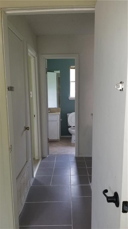 6207 Adalee Avenue, Unit B Austin, TX 78723 - Photo 9 of 11 a bathroom with a sink and toilet