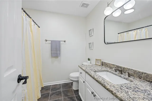 a view of a balcony with wooden floor
