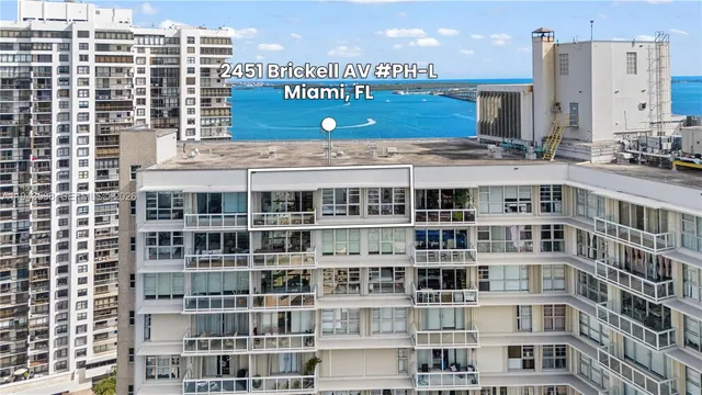 a lobby with furniture and flat screen tv