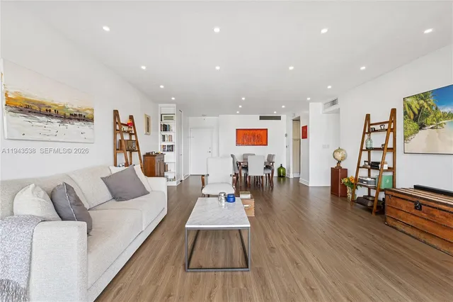a kitchen with granite countertop a sink stainless steel appliances and cabinets