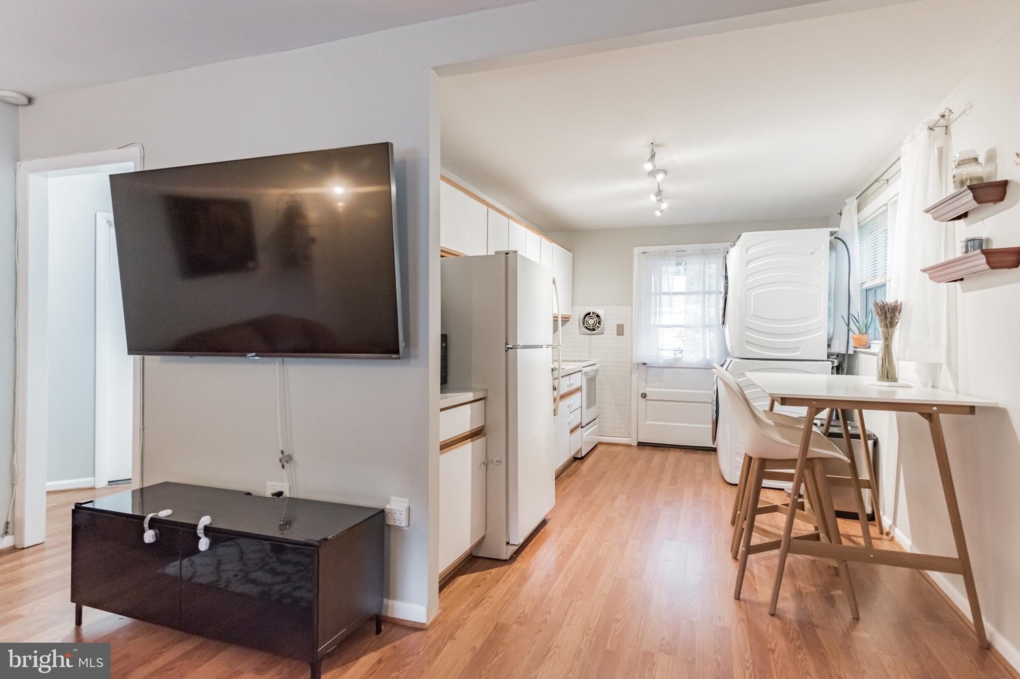 1729 Ridgely Road Edgewater, MD 21037 - Photo 16 of 29 a living room with stainless steel appliances furniture and a flat screen tv