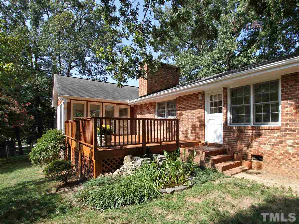 401 Sampson Street Raleigh, NC 27609 - Photo 23 of 25 a front view of a house with garden