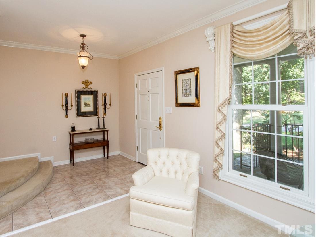 401 Sampson Street Raleigh, NC 27609 - Photo 4 of 25 a living room with furniture and a window