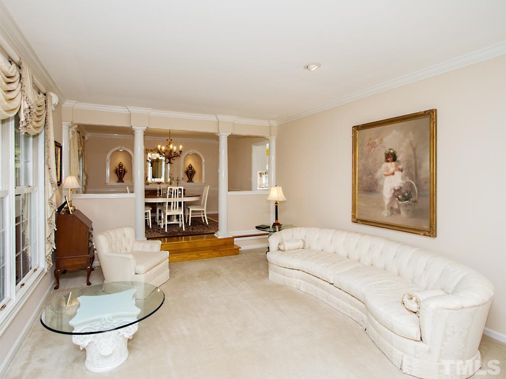 401 Sampson Street Raleigh, NC 27609 - Photo 5 of 25 a living room with furniture and a couch