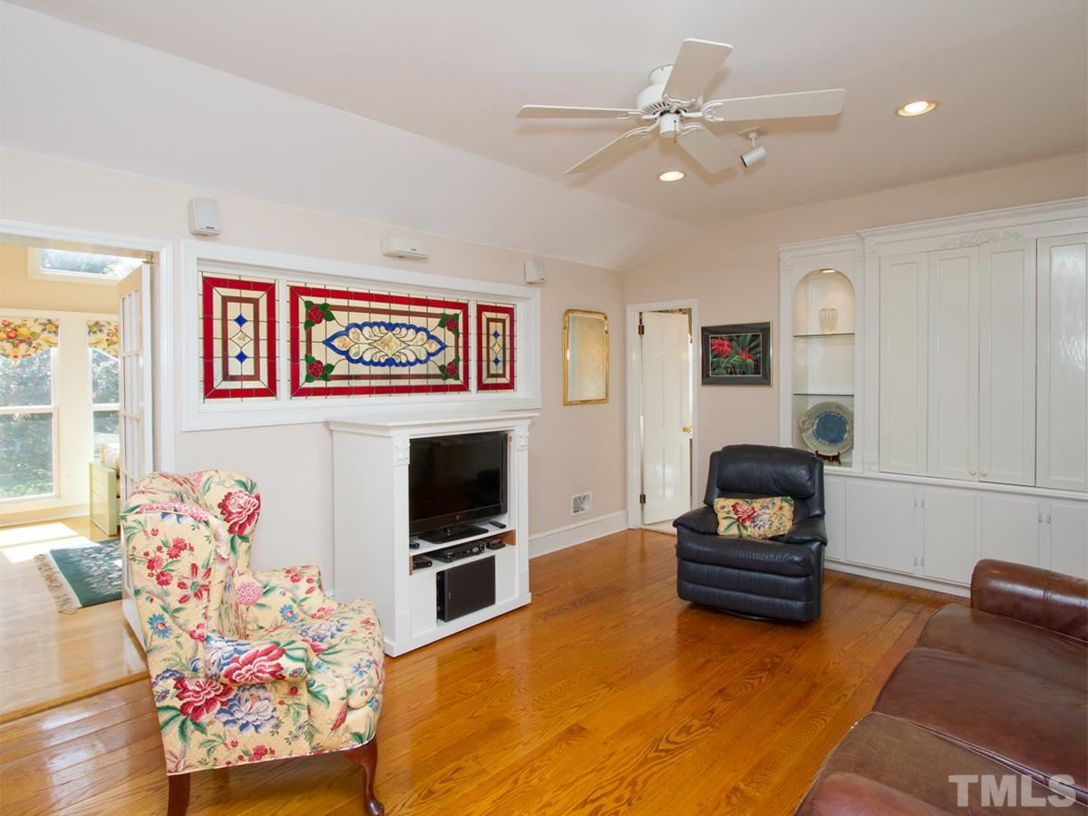 401 Sampson Street Raleigh, NC 27609 - Photo 7 of 25 a living room with furniture and a flat screen tv