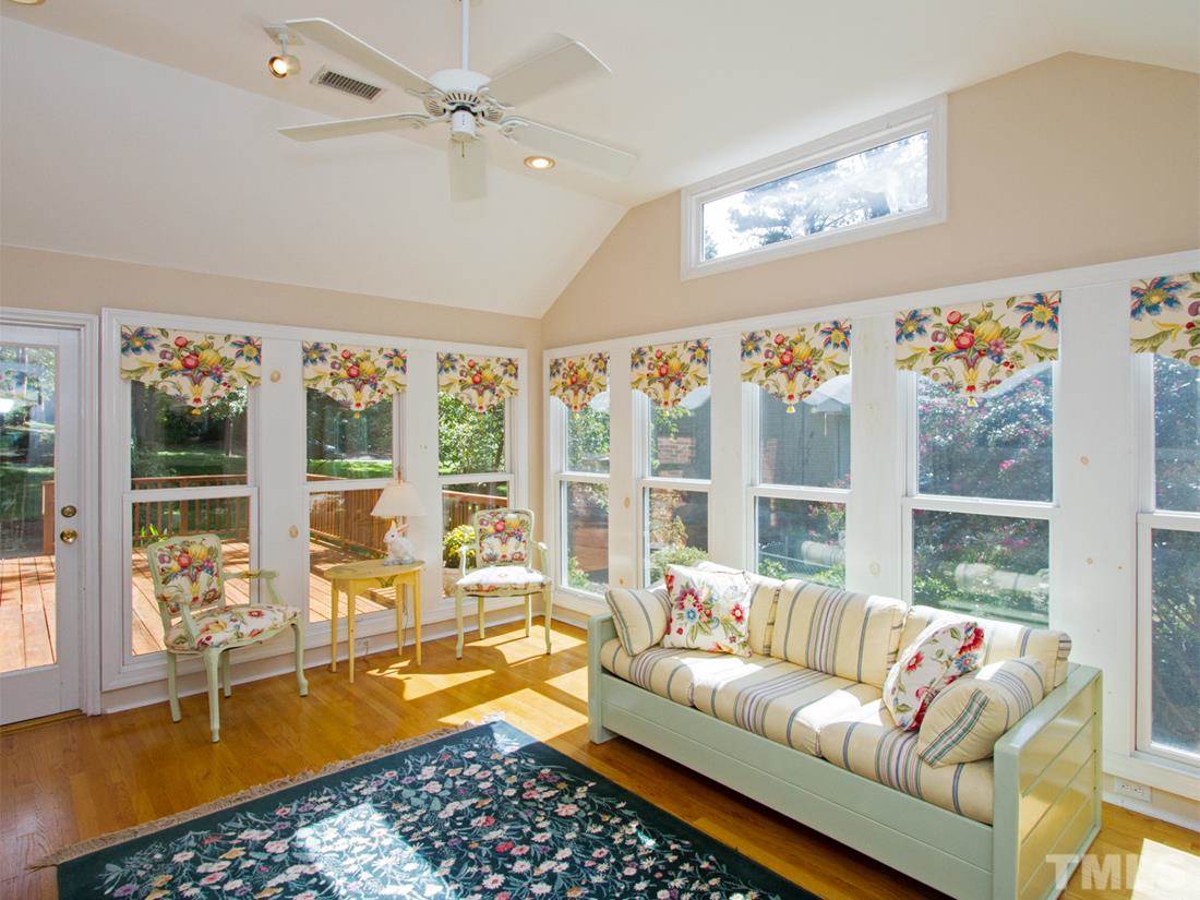 401 Sampson Street Raleigh, NC 27609 - Photo 9 of 25 a living room with furniture and a large window