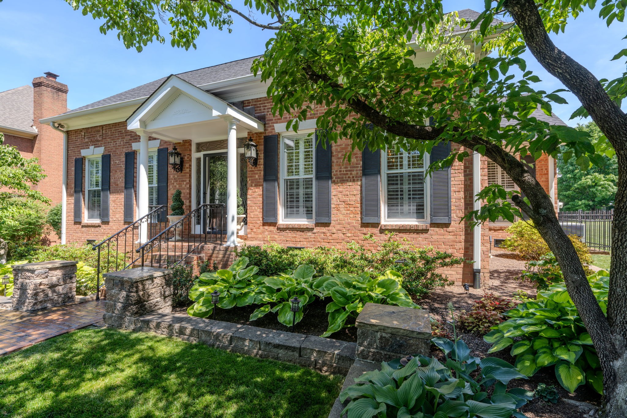 404 Chesterfield Place Franklin, TN 37064 - Photo 3 of 38 a front view of a house with garden