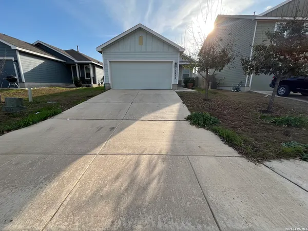 a front view of a house with yard