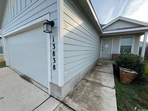 a view of a pathway besides a house