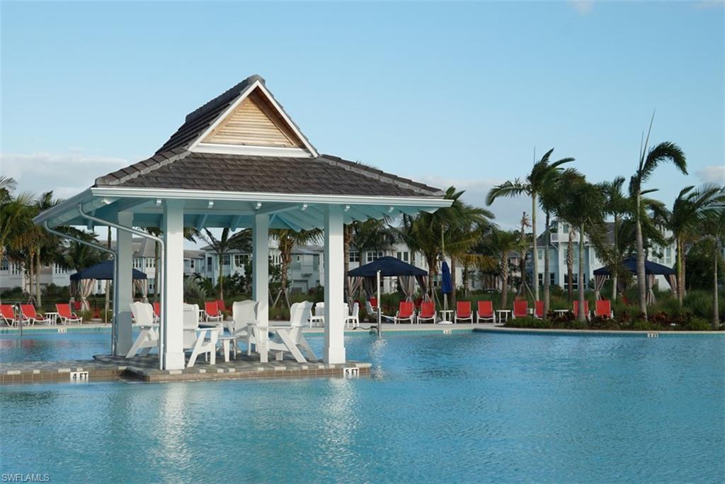 7138 Cayo Coco Lane Naples, FL 34113 - Photo 26 of 42 a view of a house with swimming pool