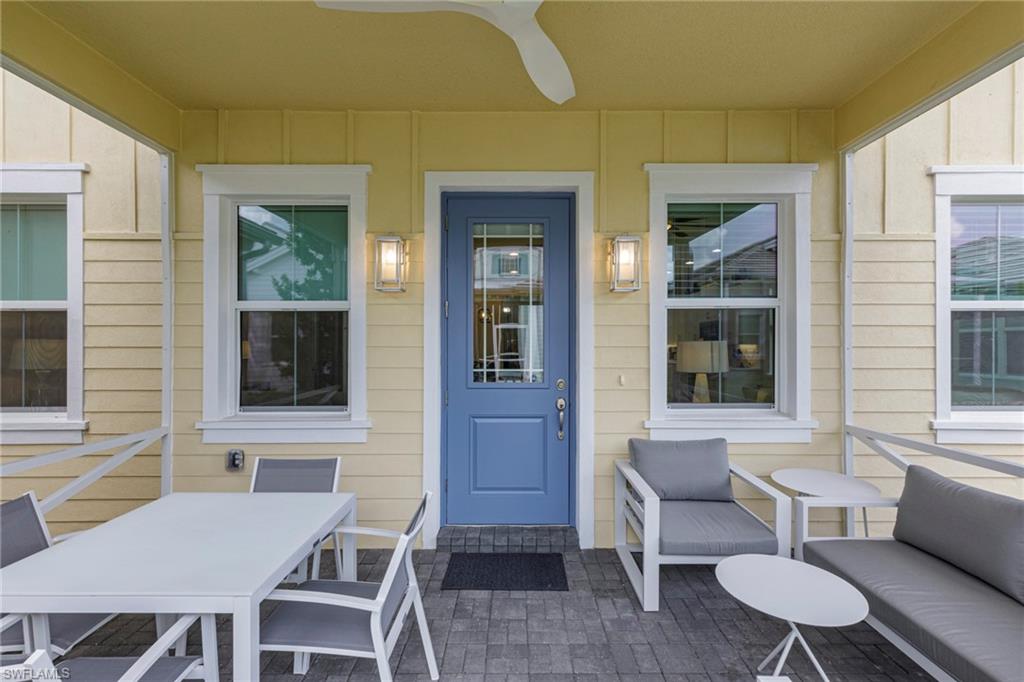 7138 Cayo Coco Lane Naples, FL 34113 - Photo 4 of 42 a outdoor space with a couch and chairs
