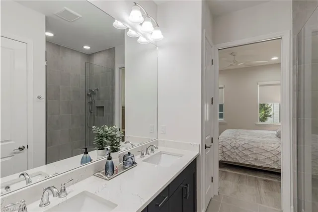 a bathroom with a sink a vanity and a mirror