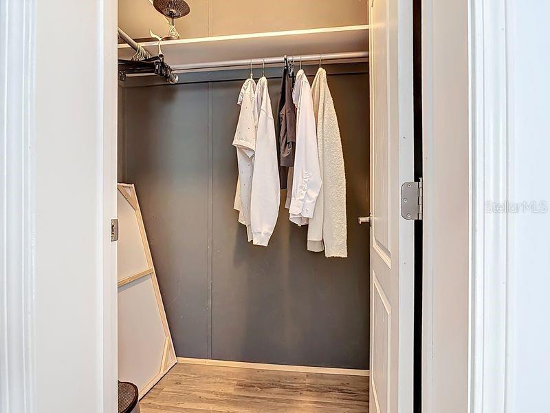 102 Ash Street Edgewater, FL 32141 - Photo 23 of 36 a view of walk in closet with clothes and shoes