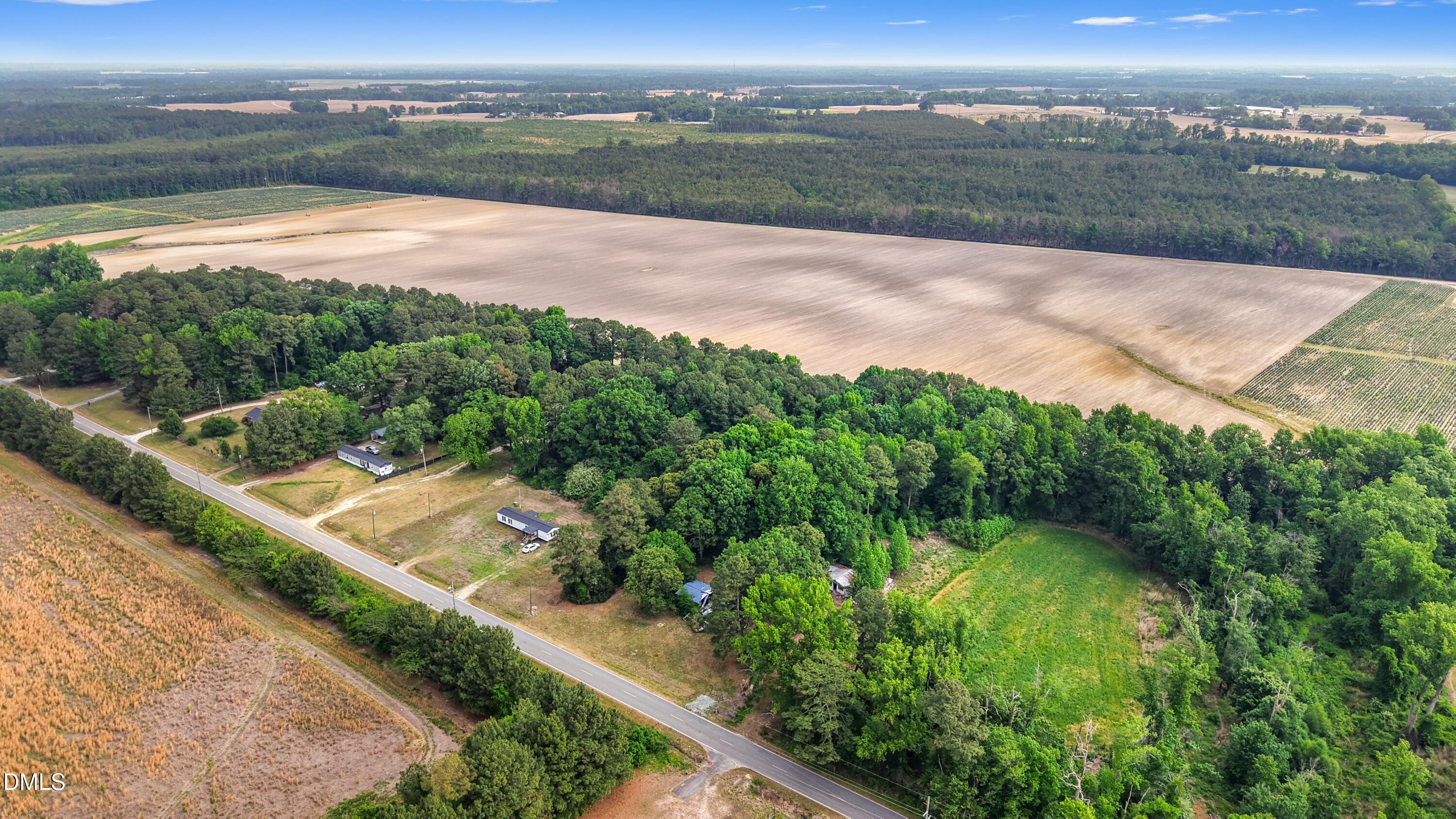 3237 East Darden Road Faison, NC 28341 - Photo 5 of 9 a view of a lake with a city view