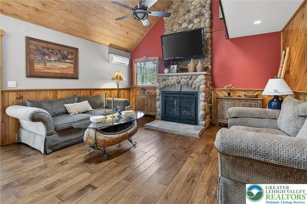 a kitchen with stainless steel appliances kitchen island granite countertop a refrigerator and microwave