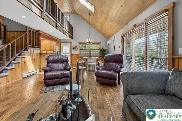 a kitchen with stainless steel appliances granite countertop a sink stove and wooden cabinets