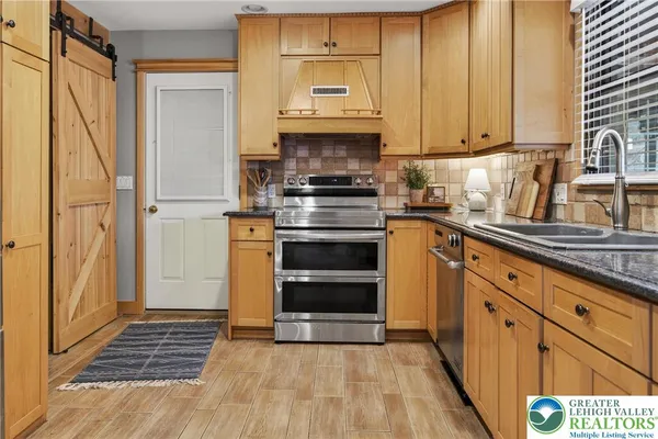 a garage with a washing machine and racks