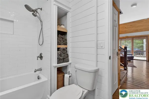 a bed room with a bed and a chandelier