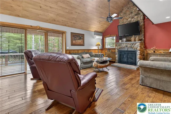 a dining room with furniture window and wooden floor