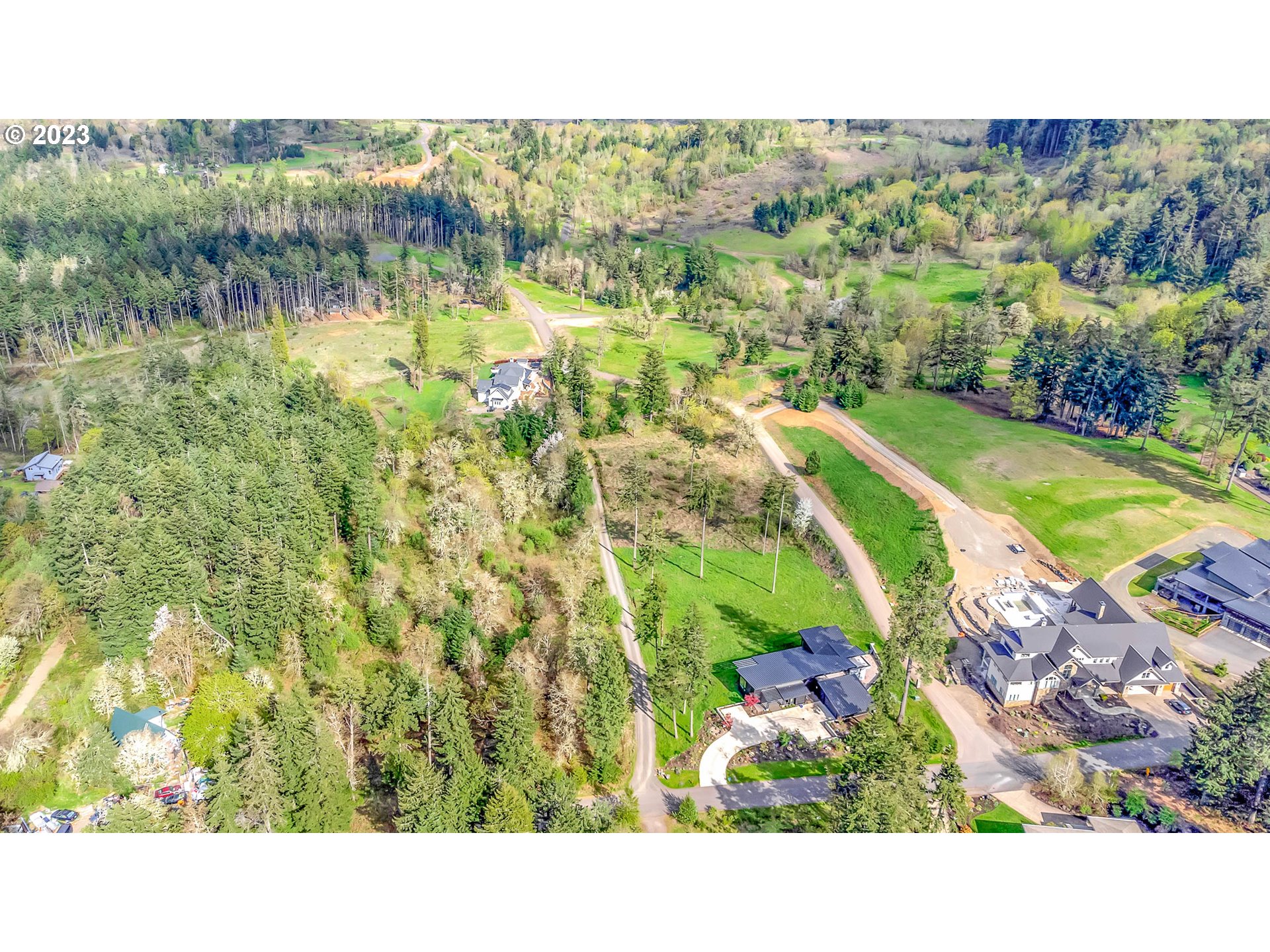 Spring Boulevard Eugene, OR 97405 - Photo 10 of 34 a open area with green field and trees in the background