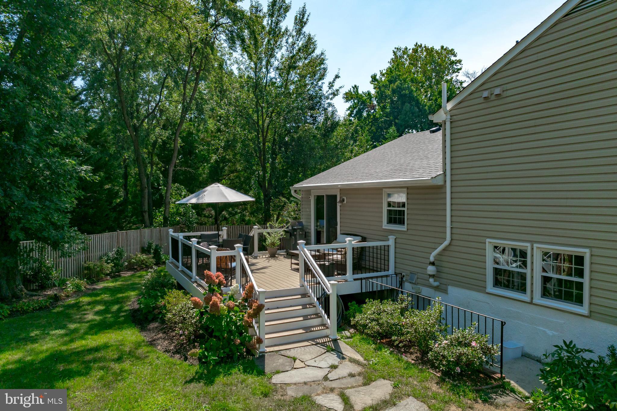 333 Brunswick Place Riva, MD 21140 - Photo 50 of 60 a view of a patio with table and chairs under an umbrella