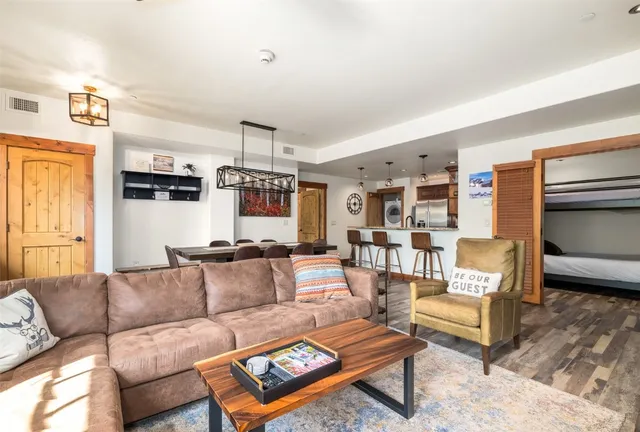 a living room with furniture and a rug