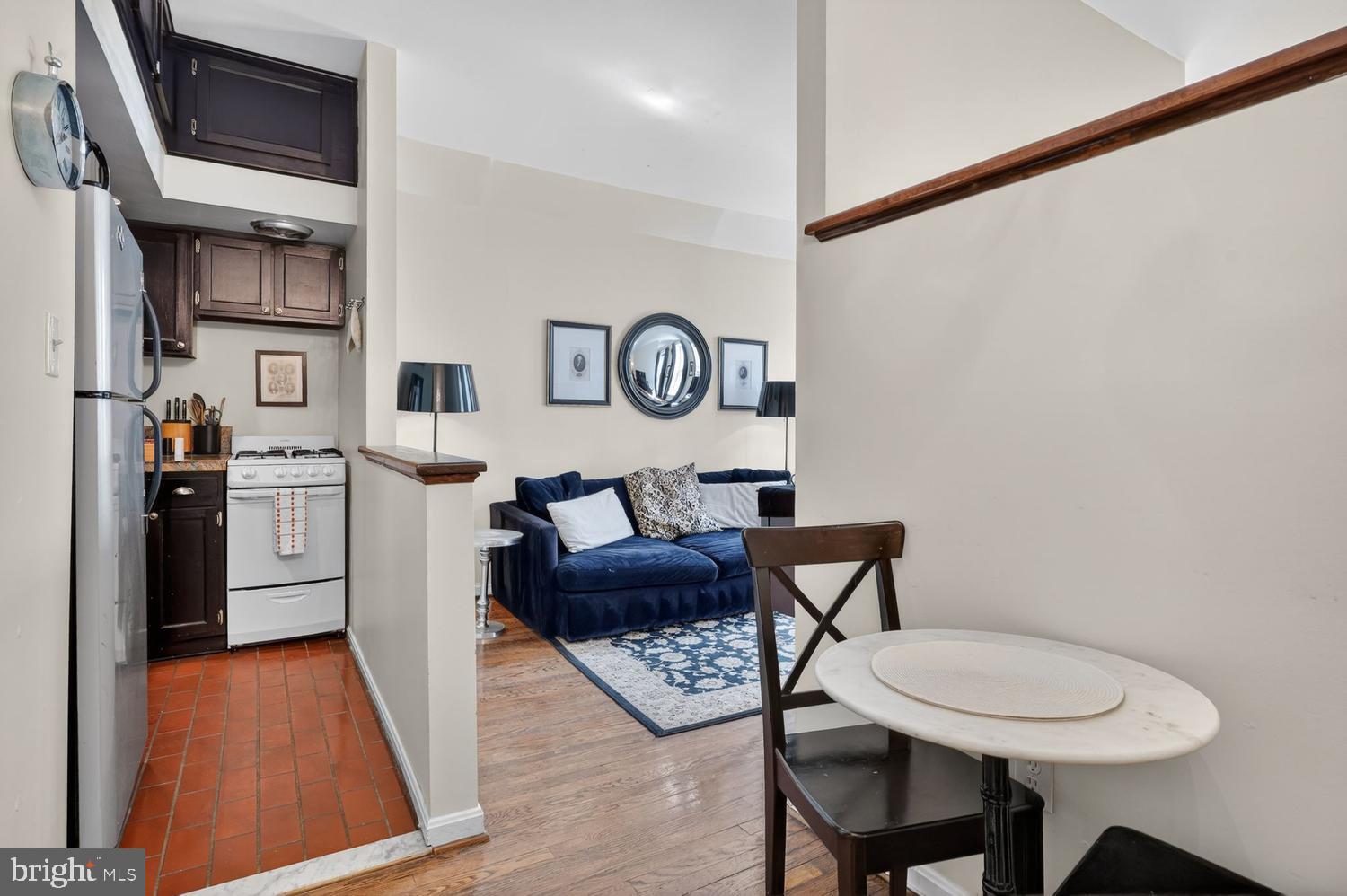 11 2nd Street Northeast, Unit 208 Washington, DC 20002 - Photo 5 of 12 a view of kitchen with furniture and wooden floor