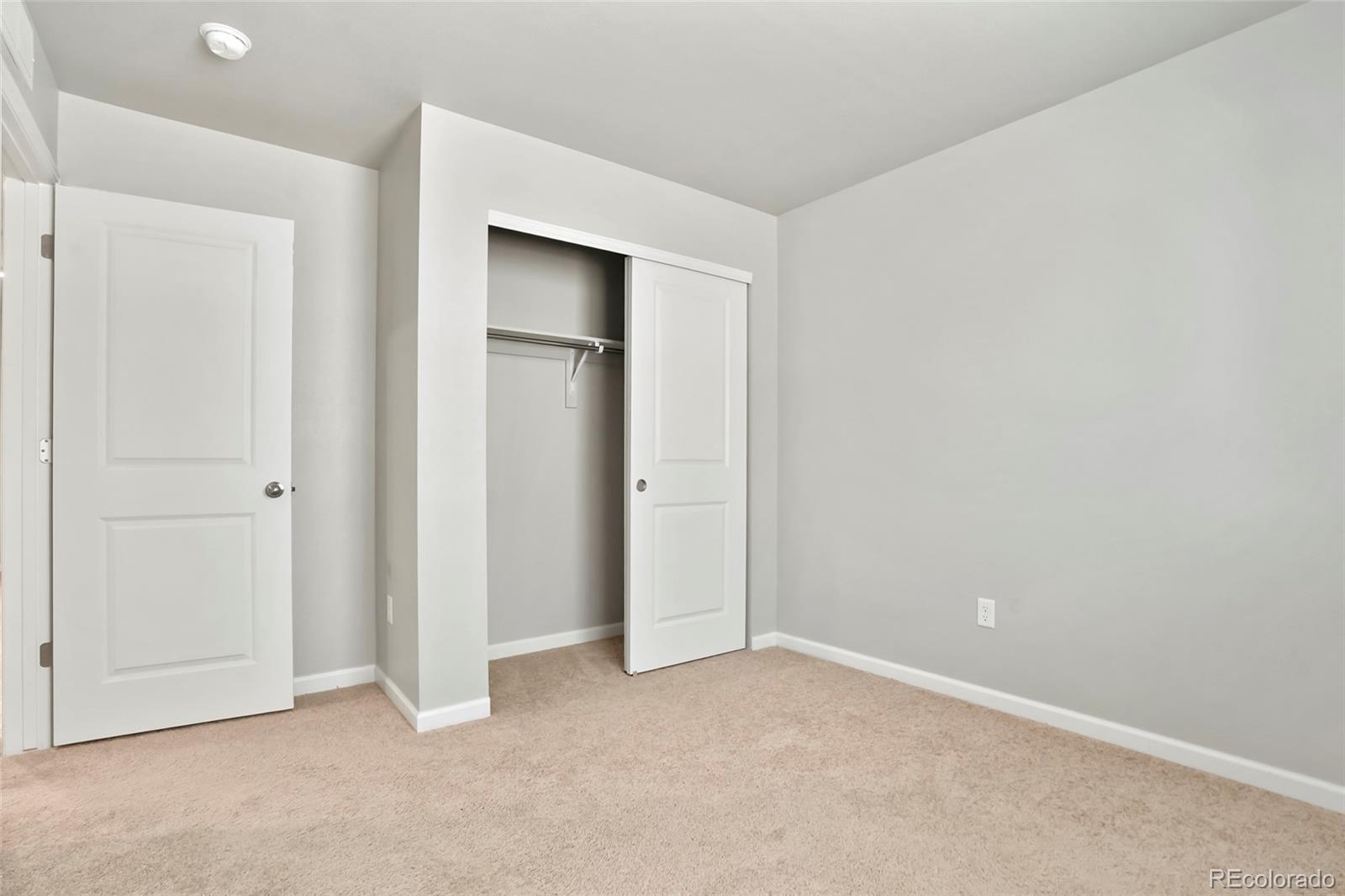 1843 Homestead Drive Fort Lupton, CO 80621 - Photo 27 of 33 an empty room with closet area