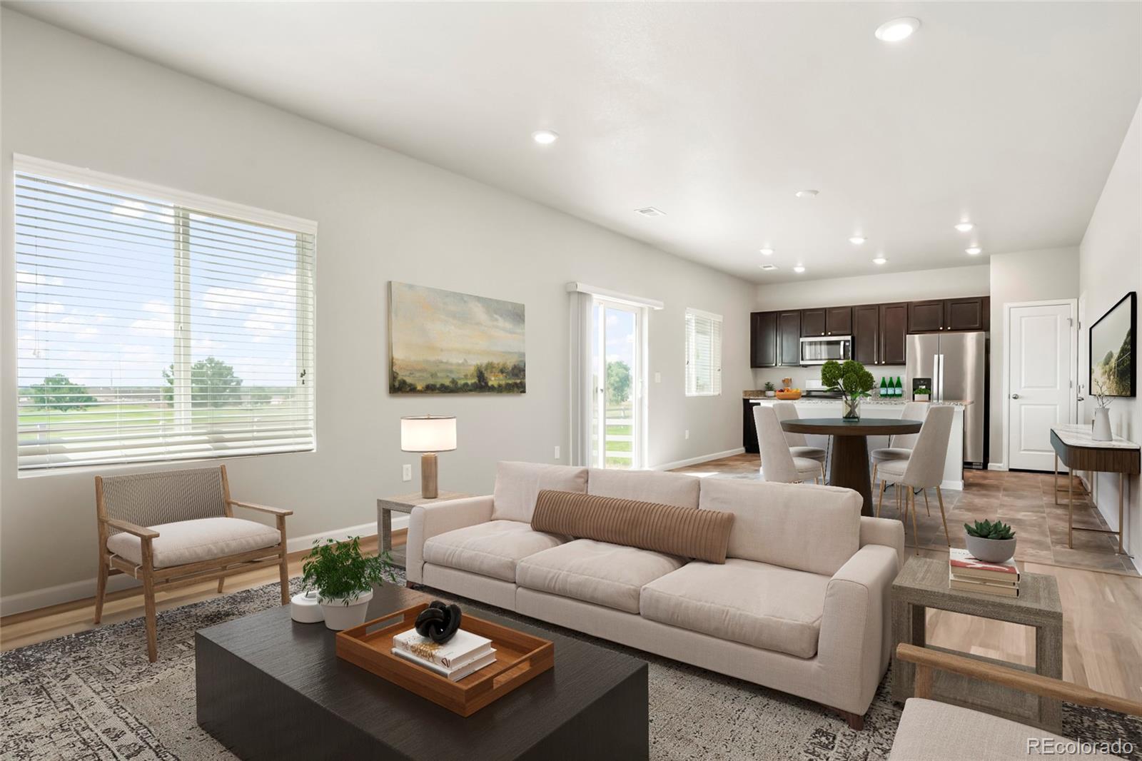 1843 Homestead Drive Fort Lupton, CO 80621 - Photo 3 of 33 a living room with furniture and a large window