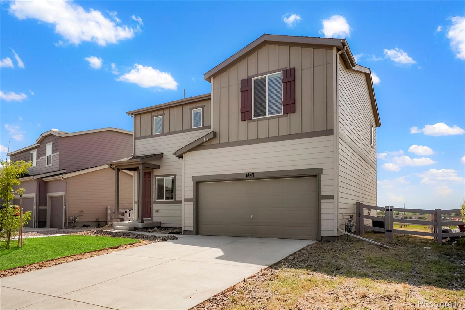 1843 Homestead Drive Fort Lupton, CO 80621 - Photo 33 of 33 a front view of a house with a yard