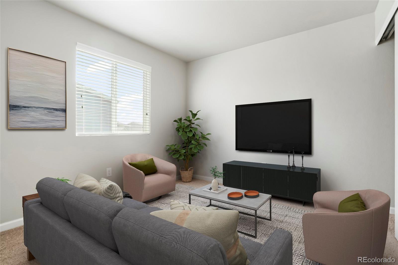 1843 Homestead Drive Fort Lupton, CO 80621 - Photo 7 of 33 a living room with furniture and a flat screen tv