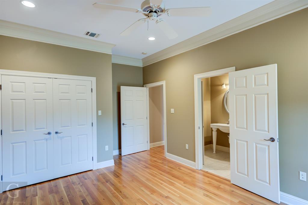 1212 WPA Road Homer, LA 71040 - Photo 30 of 35 Unfurnished bedroom with ornamental molding, a closet, light wood finished floors, recessed lighting, and baseboards
