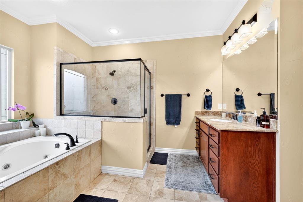 1399 Canyon Lake Road Wills Point, TX 75169 - Photo 16 of 37 a view of bathroom with mirror bathtub sink and mirror