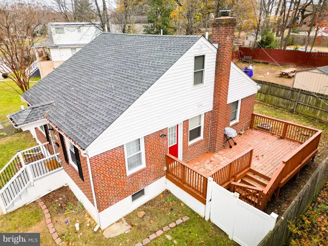 a view of a roof deck with wooden floor and fence
