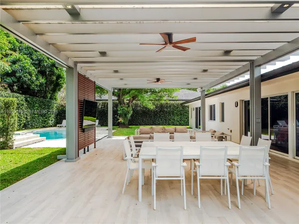 a outdoor space with lots of furniture and garden view
